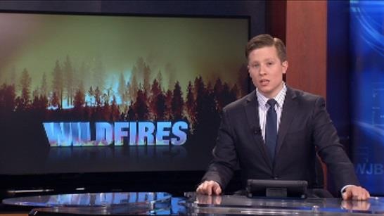 Mike Miller anchoring an evening newscast